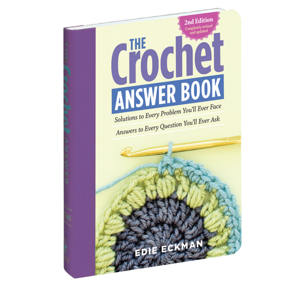 Soft yellow and purple cover of a crocheting guidebook featuring a partially completed round crochet motif in blue, green, and yellow yarn with a gold crochet hook, included in Sewing and Quilting, Home & Decor, Toys, Books & Games, and Best Sellers collections.