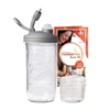 Clear wide-mouth mason jar with a gray fermentation lid and airlock plug, accompanied by packaging featuring a smiling woman, ideal for Kitchen & Food, Food Preservation, and USA Made collections.