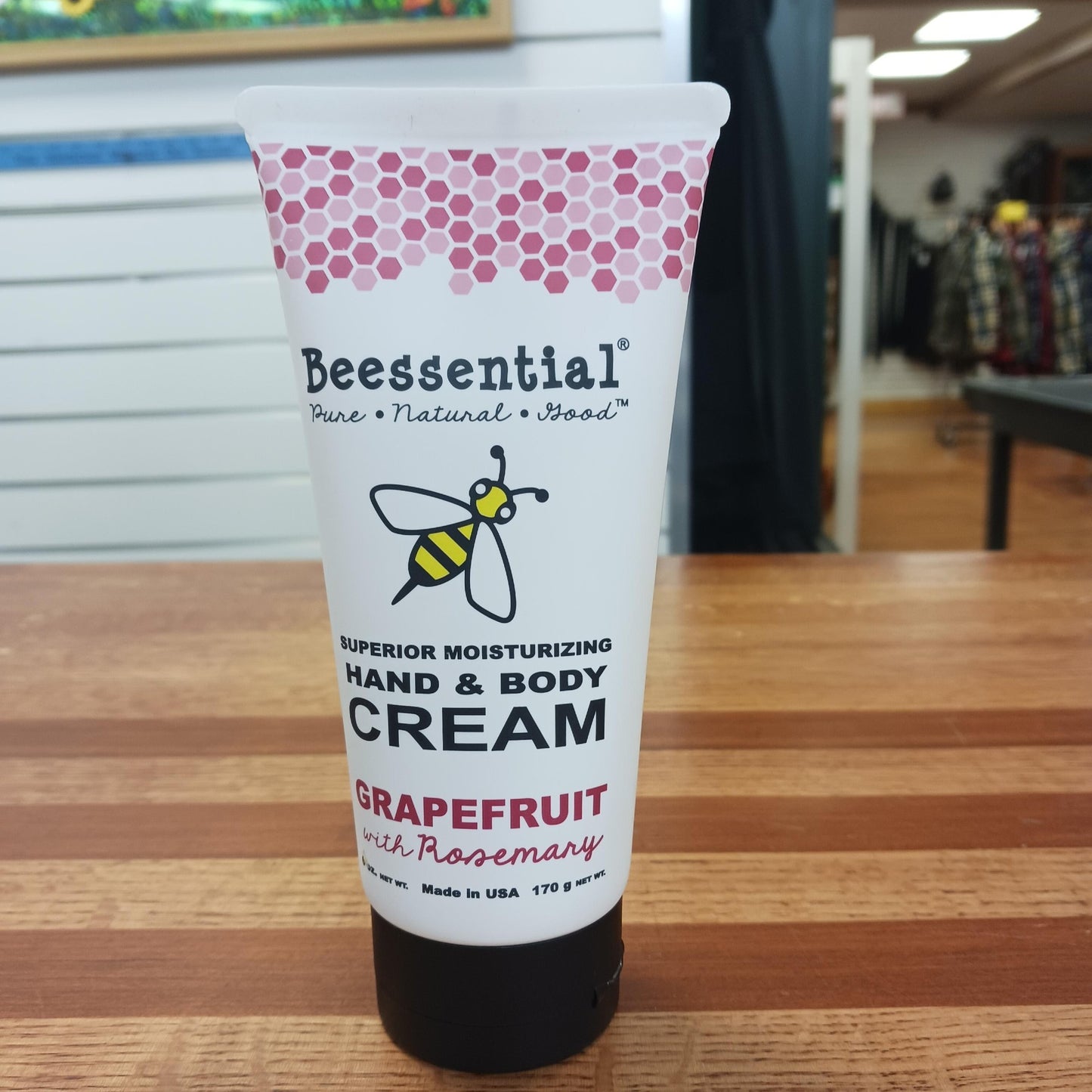 Tube of handcrafted moisturizing hand and body cream scented with grapefruit and rosemary, featuring natural ingredients, made in USA, from Health & Wellness and Balms collections.