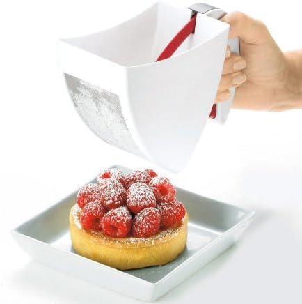 White plastic scoop and sift flour sifter held over a raspberry tart dusting fine flour, designed for Kitchen & Food, Cookware, Baking Supplies, and Bread Making collections.