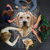 Group assembling a handcrafted 550-piece dog head shaped jigsaw puzzle featuring a Labrador design, perfect for Toys, Books & Games, Children's Toys, Games and Puzzles, Best Sellers, and Promo Eligible collections.