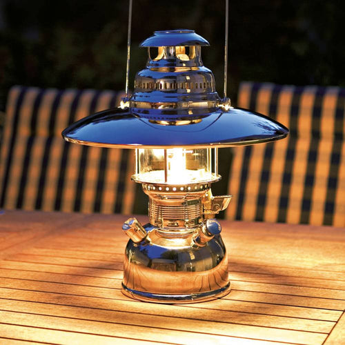 Shiny metal top reflector mounted on a classic pressure lamp, casting warm light downward, featured in lamps & lighting, parts and accessories, best sellers, and promo eligible collections.