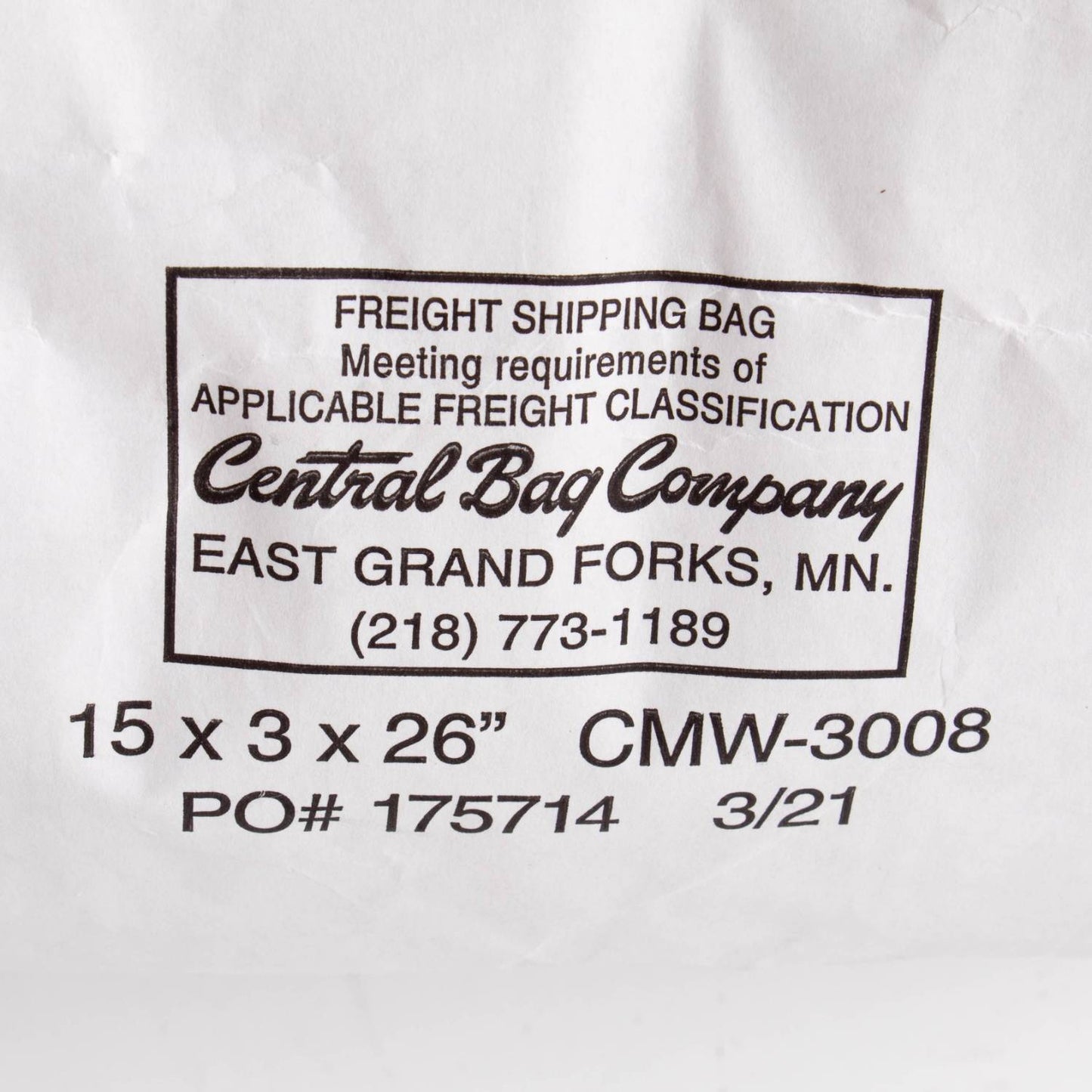 Close-up of a white shipping bag label from Central Bag Company in East Grand Forks, Minnesota, showing freight classification details and contact phone number, used for packaging organic barley groats in Farm and Pantry supplies collections.