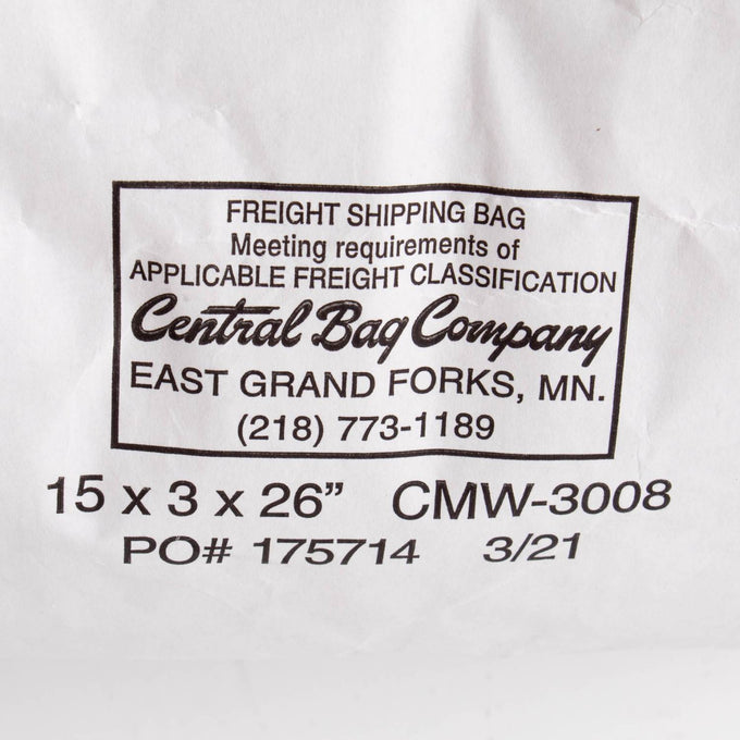Close-up of a white shipping bag label from Central Bag Company in East Grand Forks, Minnesota, showing freight classification details and contact phone number, used for packaging organic barley groats in Farm and Pantry supplies collections.
