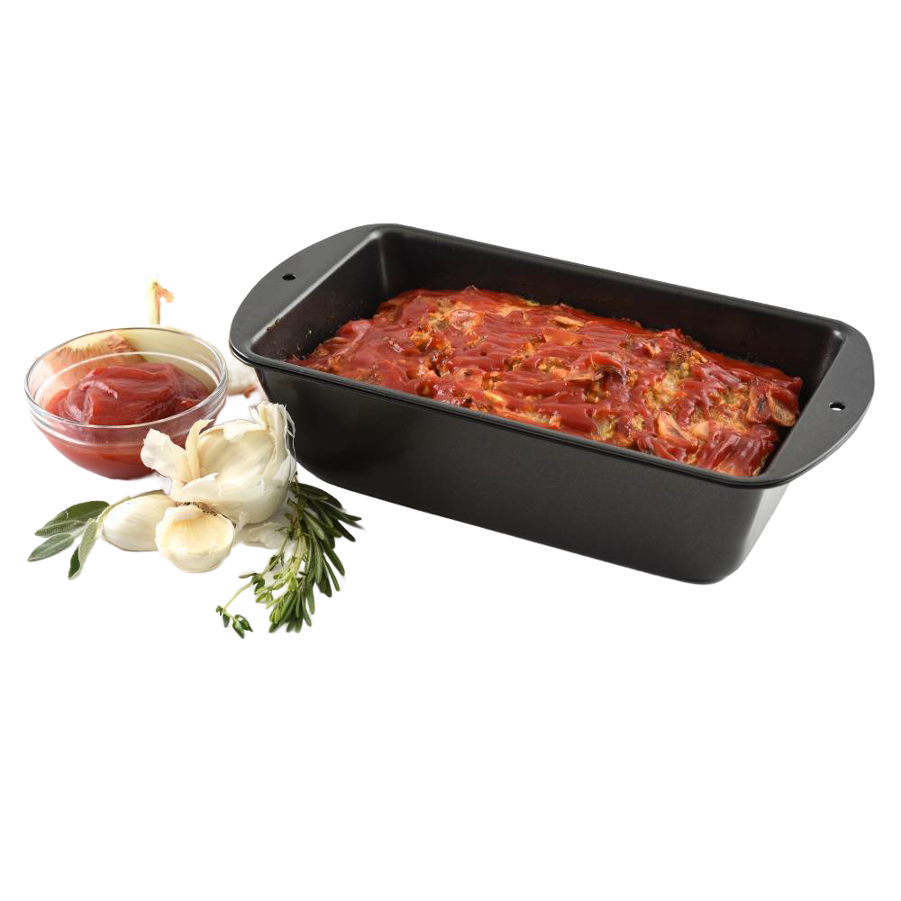 Black non-stick loaf pan with pierced inner tray for fat drainage, shown with a cooked meatloaf topped with tomato sauce, alongside fresh garlic, rosemary, and a bowl of sauce, ideal for Kitchen & Food, Cookware, Baking Supplies, Best Sellers, and Bread Making Supplies collections.