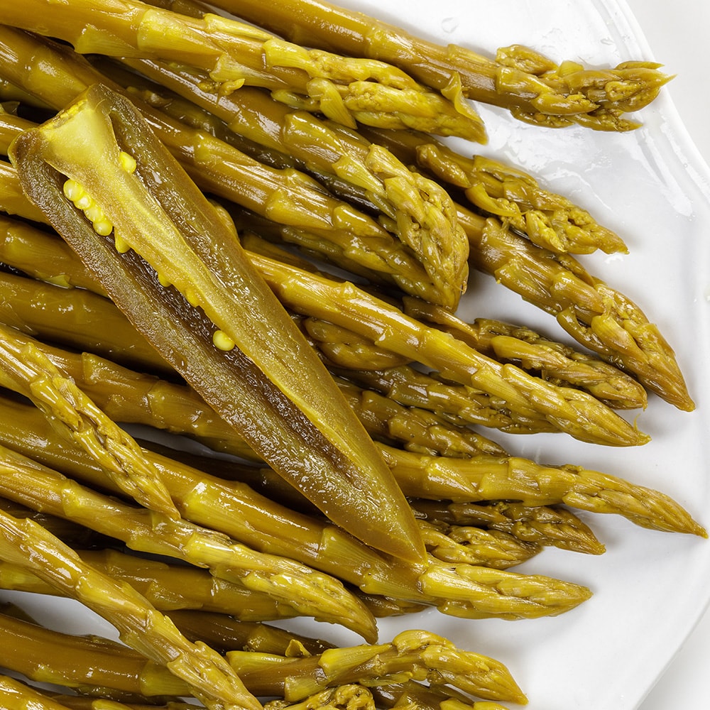 Close-up of handcrafted pickled asparagus spears with a sliced jalapeno, highlighting tangy, spicy flavor and Amish-made quality, ideal for Kitchen & Food, Pantry, USA Made, Best Sellers, and Promo Eligible collections.