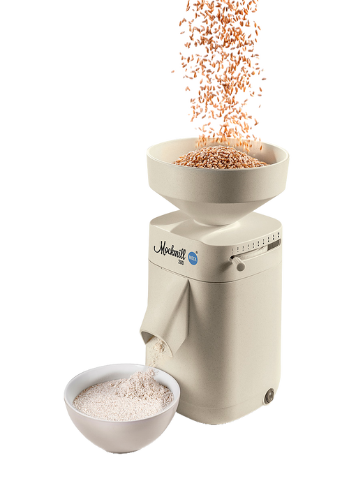 Electric grain mill with a beige finish grinding wheat into fresh flour, featuring a top hopper and bowl below, perfect for Kitchen & Food and Grain Mills collections.