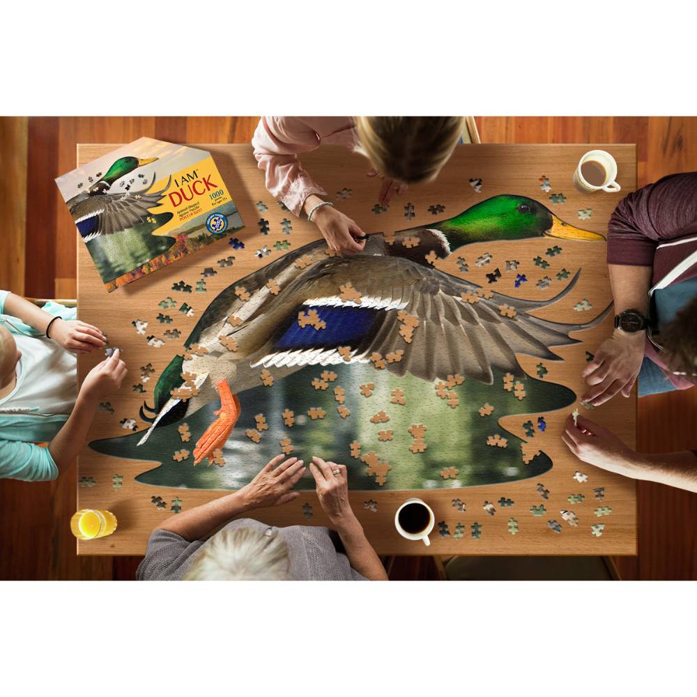 Group of people assembling a uniquely shaped duck puzzle with interlocking pieces on a wooden table, accompanied by a duck-themed book, part of Toys, Books & Games and Puzzles collections.