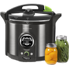 Modern electric pressure canner with stainless steel body and black handle featuring a digital display and green control accents, shown alongside jars of preserved vegetables in Kitchen & Food and Food Preservation collections.