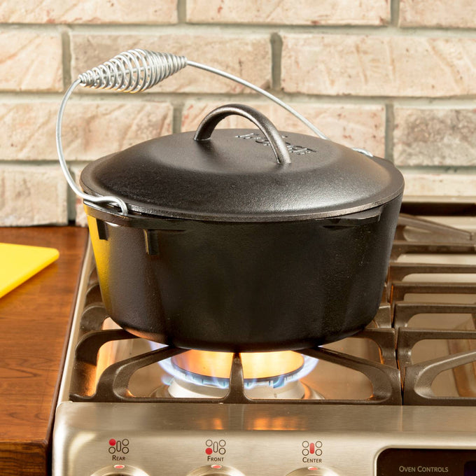 Black cast iron Dutch oven with spiral handle and self-basting lid, pre-seasoned and ready to use, suitable for Kitchen & Food, Cookware, Cast Iron, USA Made, and Best Sellers collections.