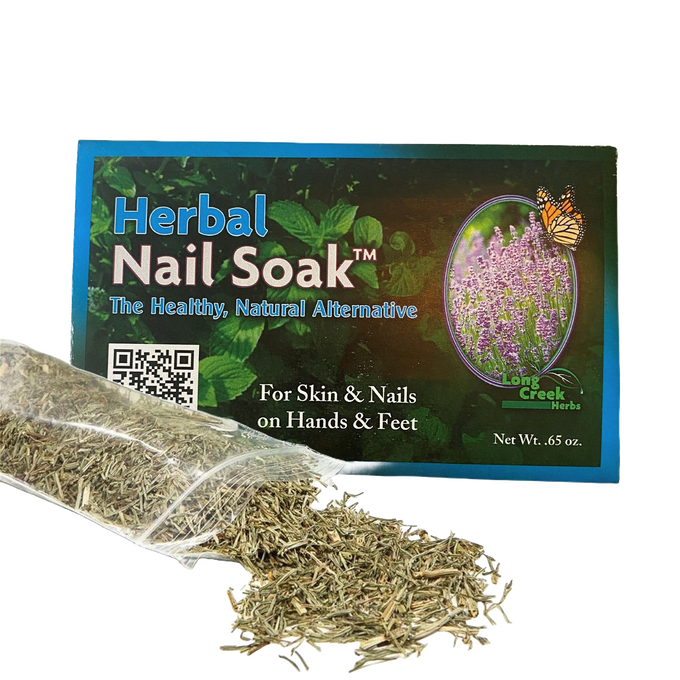 Box of herbal nail soak labeled as a natural remedy for skin and nails on hands and feet, featuring loose dried herbs spilling from a clear plastic bag, highlighting USA made health and wellness product benefits.