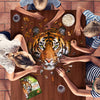 Children assembling a 300-piece tiger-shaped jigsaw puzzle on a wooden table, with a fun facts booklet nearby and snacks, featured in Toys, Books & Games collections.