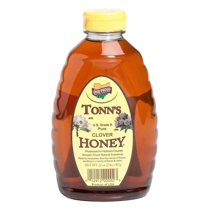 32 oz bottle of pure honey with amber color and yellow cap, featuring a label highlighting U.S. Grade A clover honey made in USA, ideal for Kitchen & Food and Pantry collections.