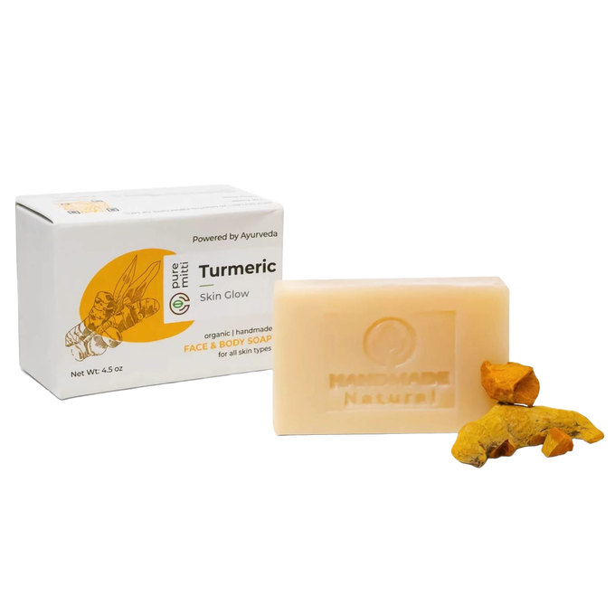 Handcrafted turmeric bar soap with natural ingredients and brightening properties, displayed alongside turmeric root pieces and packaging, ideal for Health & Wellness, Soaps, and Best Sellers collections.