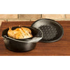 Pre-seasoned cast iron Dutch oven with spiral handle and self-basting lid, shown with roasted chicken, ideal for Kitchen & Food, Cookware, Cast Iron, USA Made, and Best Sellers collections.