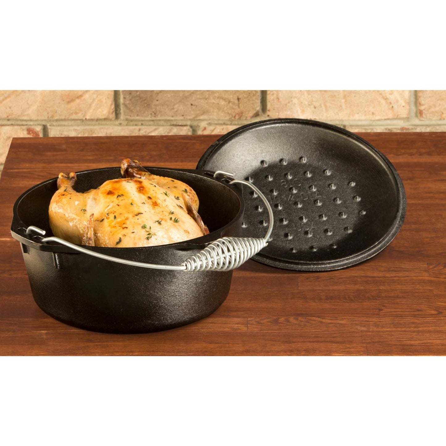 Pre-seasoned cast iron Dutch oven with spiral handle and self-basting lid, shown with roasted chicken, ideal for Kitchen & Food, Cookware, Cast Iron, USA Made, and Best Sellers collections.