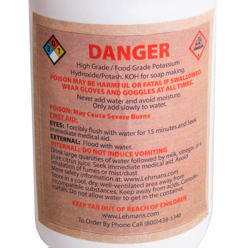 Close-up of a high-grade potassium hydroxide (potash) container label with safety warnings, first aid instructions, and handling precautions for soapmaking, featured in Health & Wellness and Soapmaking Supplies collections.