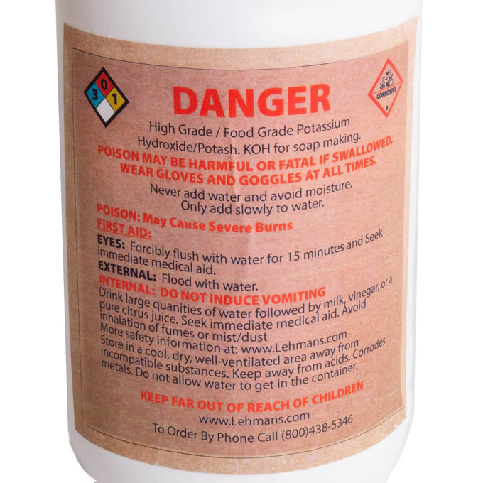 Close-up of a high-grade potassium hydroxide (potash) container label with safety warnings, first aid instructions, and handling precautions for soapmaking, featured in Health & Wellness and Soapmaking Supplies collections.