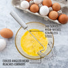 Stainless steel coil whisk with angled head designed to reach pan corners, shown whisking beaten eggs next to carton of brown and white eggs, part of Kitchen & Food and USA Made collections.