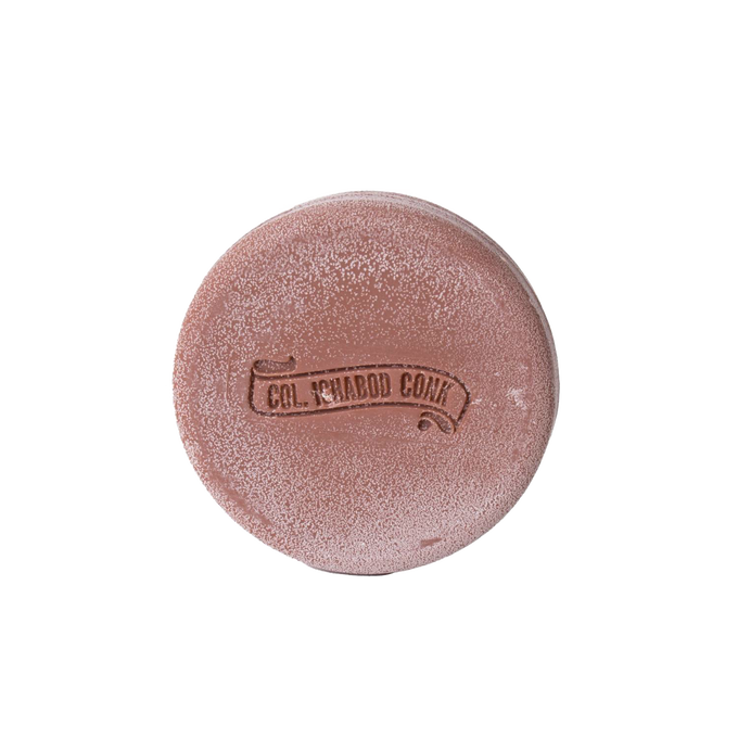 Round brown shaving soap bar embossed with vintage branding, featuring moisturizing ingredients like shea butter and avocado oil, ideal for Health & Wellness and Grooming collections.