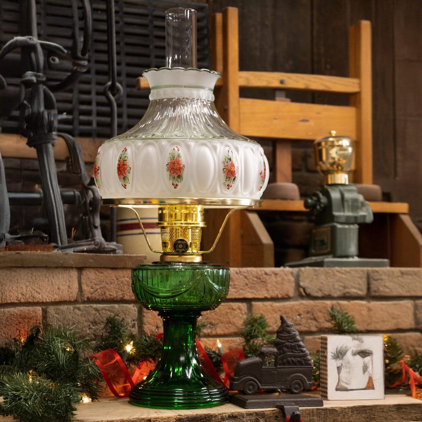 Handcrafted oil lamp with a rich emerald green glass base and ornate white glass font decorated with floral accents, featuring brass trim, ideal for Lamps & Lighting and Table Lamps collections.