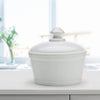 Milk-colored glass butter tub with a matching lid, handcrafted in the USA, ideal for Kitchen & Food, Dinnerware, and Storage and Serving collections.