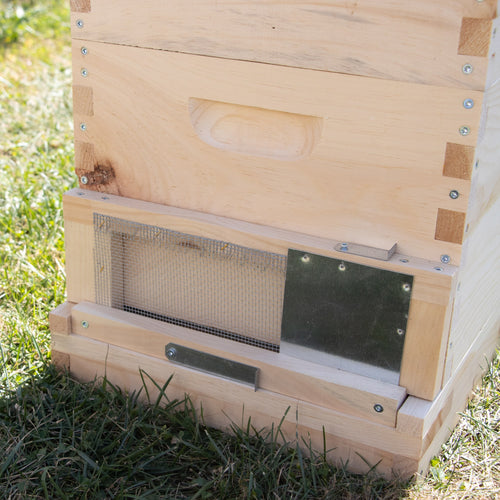 Handmade Amish-crafted wooden bee hive entrance with metal mesh and adjustable metal latch to control bee access, protecting colonies in Farm, Garden & Tool and Beekeeping Supplies collections.