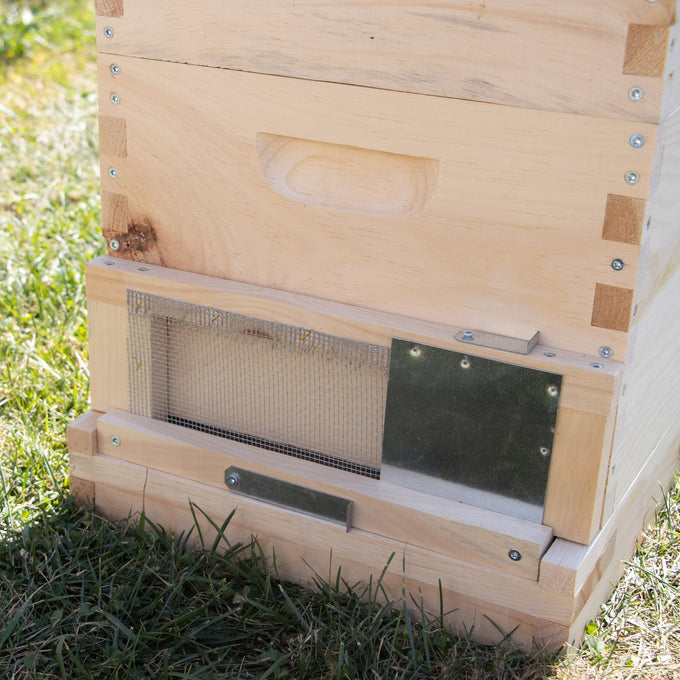 Handmade Amish-crafted wooden bee hive entrance with metal mesh and adjustable metal latch to control bee access, protecting colonies in Farm, Garden & Tool and Beekeeping Supplies collections.