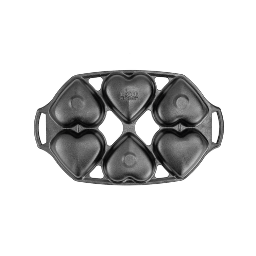 Cast iron mini cake pan with six heart-shaped molds, featuring sturdy handles and a naturally seasoned surface, ideal for baking in Kitchen & Food and Cast Iron collections.