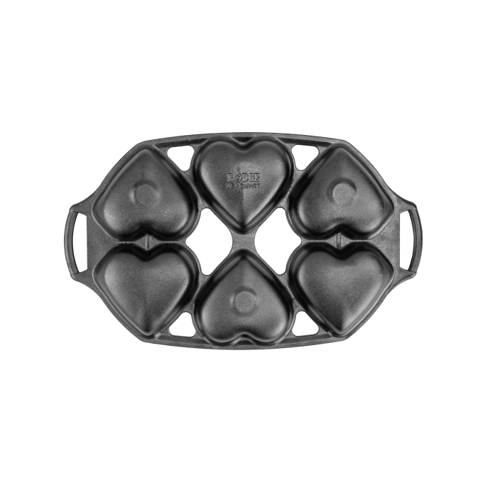 Cast iron mini cake pan with six heart-shaped molds, featuring sturdy handles and a naturally seasoned surface, ideal for baking in Kitchen & Food and Cast Iron collections.