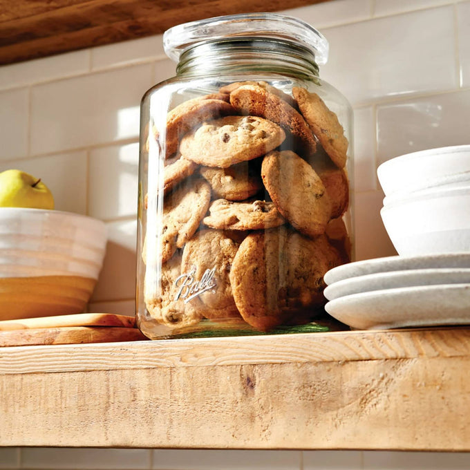 Clear glass stackable jar filled with homemade cookies, featuring an airtight silicone-sealed lid on a wooden kitchen shelf, perfect for Home & Decor and Kitchen & Food collections.