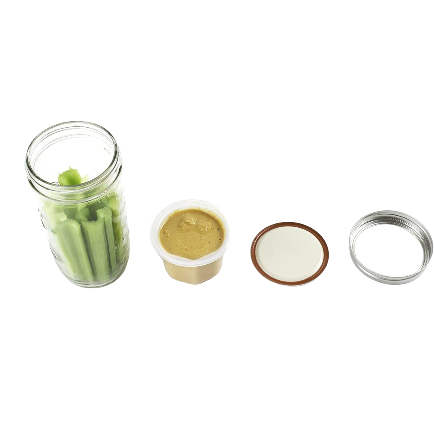 Clear wide-mouth jar filled with celery stalks alongside a plastic divider cup with beige dip, plus two separate metal jar lids, showcasing a handcrafted lunch container accessory made in USA for Kitchen & Food and Storage collections.