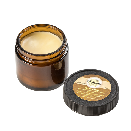 Amber glass jar of all-natural vapor rub with a smooth beeswax and coconut oil-based balm, featuring a round black lid with a beige label, ideal for Health & Wellness and USA Made collections.