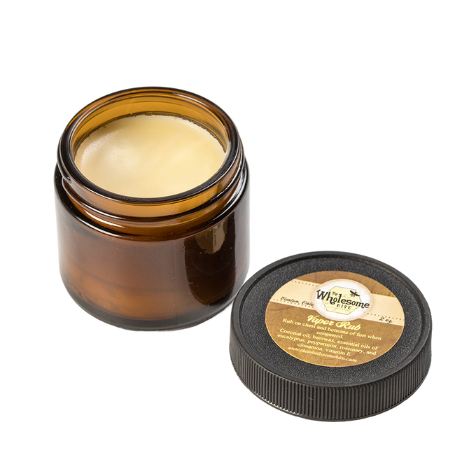 Amber glass jar of all-natural vapor rub with a smooth beeswax and coconut oil-based balm, featuring a round black lid with a beige label, ideal for Health & Wellness and USA Made collections.