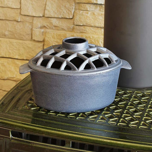 Heavy-duty flat black cast iron stovetop steamer with a lattice vented lid, designed to add natural moisture to indoor air, featured in Stoves, Hearth Accessories, and Best Sellers collections.