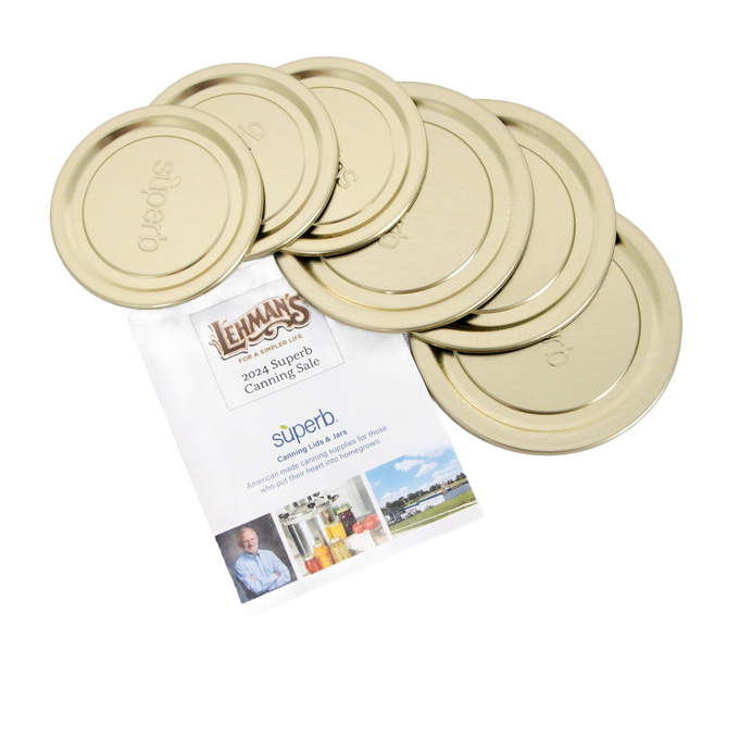 Set of beige mason jar lids arranged over a Lehman's promotional flyer featuring canning and preserving products, suitable for Kitchen & Food, Kitchen Accessories, and Storage and Serving collections.