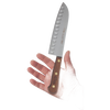 Handheld 7-inch Santoku knife with a wooden handle and distinctive blade dimples designed to prevent food sticking, crafted for kitchen and food prep in USA Made and Best Sellers collections.