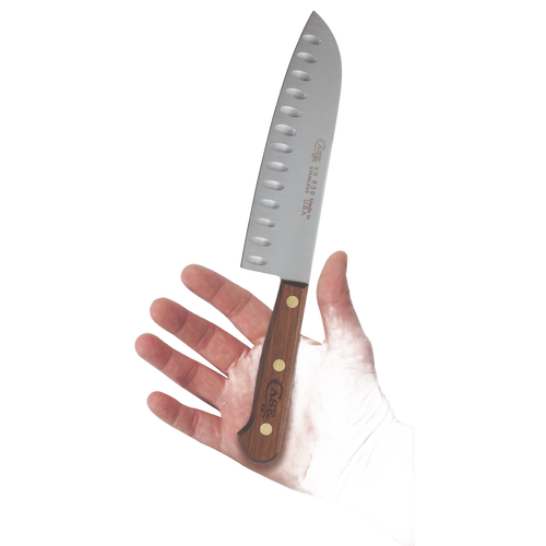 Handheld 7-inch Santoku knife with a wooden handle and distinctive blade dimples designed to prevent food sticking, crafted for kitchen and food prep in USA Made and Best Sellers collections.