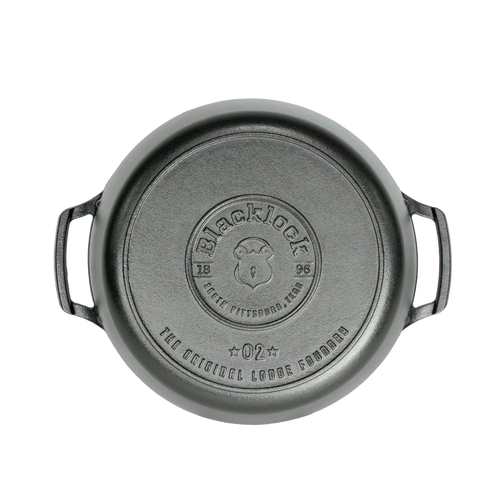 Top view of a lightweight cast iron Dutch oven with dual handles and embossed branding, handcrafted in the USA, featured in Kitchen & Food, Cookware, Cast Iron, and Best Sellers collections.