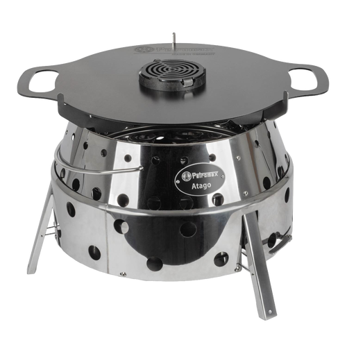 Shiny stainless steel outdoor stove with perforated sides and foldable legs, topped with a flat black griddle insert, ideal for Farm, Garden & Tool, Stoves, Camping, Grilling, and Best Sellers collections.