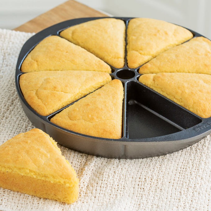 Heavy cast aluminum pan with eight divided sections for evenly baked cornbread slices, featuring a nonstick surface, handcrafted and made in USA, ideal for kitchen, cookware, and homesteading collections.