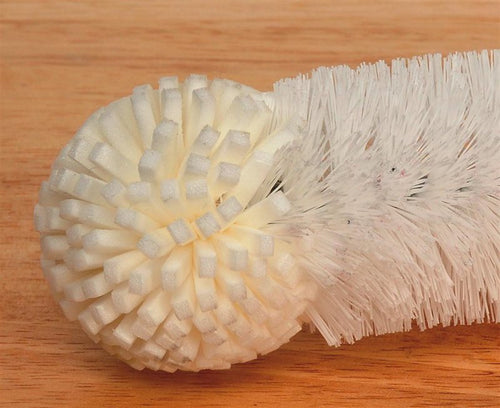 Close-up of a white foam tip cleaning brush with soft nonabrasive bristles and a round foam head, designed for gentle cleaning of jars and bottles, featured in household cleaning and USA made collections.