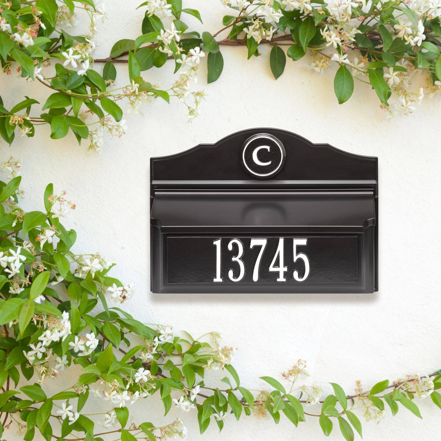 Handcrafted black and white wall mount mailbox featuring a raised circular monogram and house number, designed to enhance curb appeal in Home & Decor and USA Made collections.