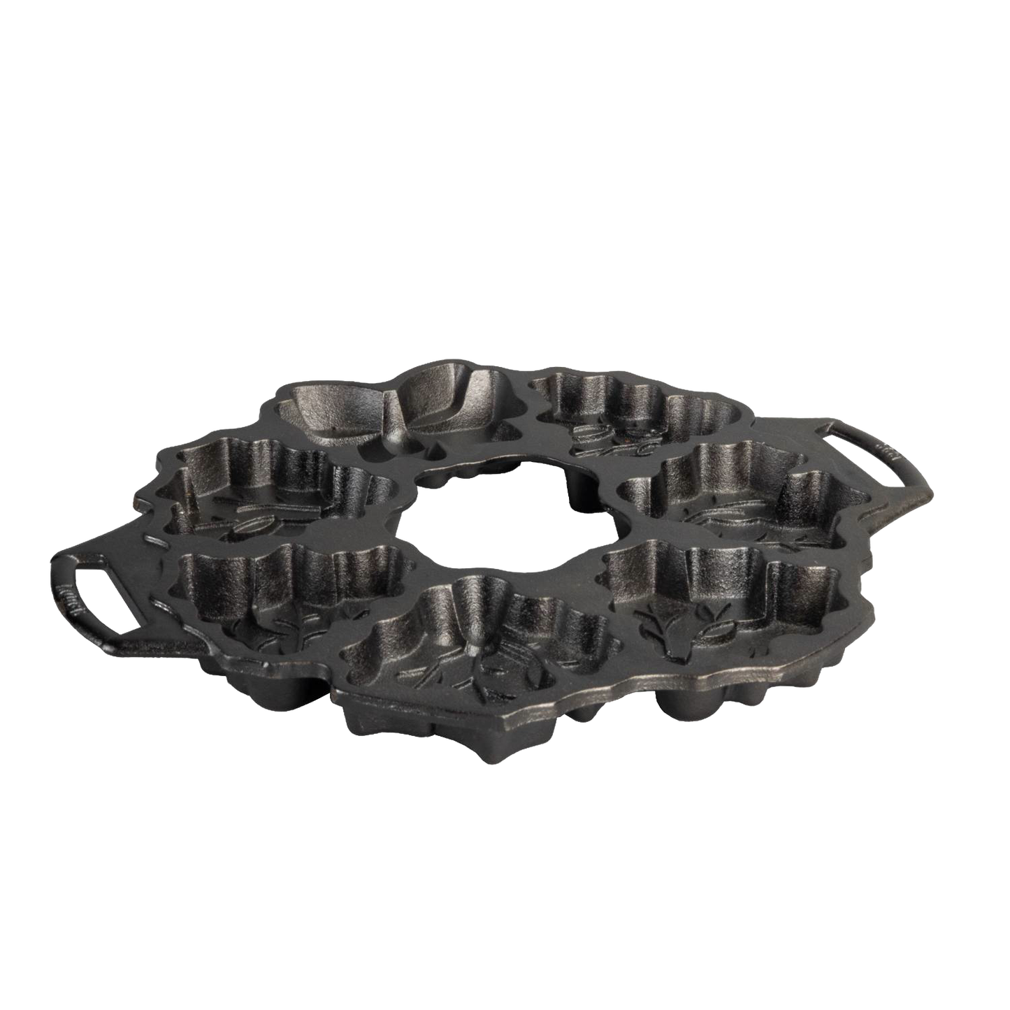 Seasoned cast iron cakelet pan shaped with festive holiday wreath motifs including holly and berries, featuring dual handles for easy handling, ideal for Kitchen & Food and Cast Iron collections.