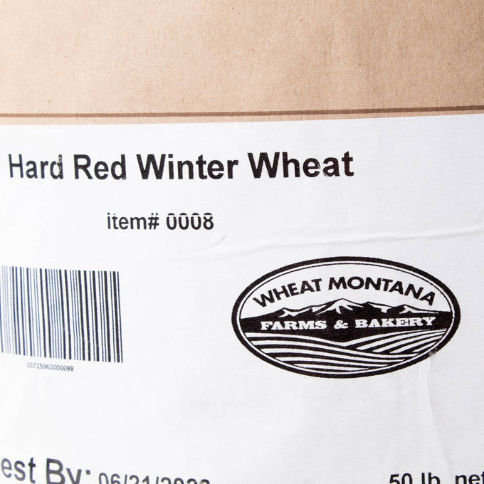 Close-up of the label on a 50-pound bag of hard red winter wheat with a Montana farm logo, featured in Farm, Garden & Tool, Pantry, Food, and USA Made collections.