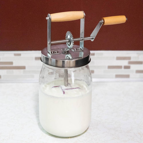 Mini glass butter churn with wooden handle crank and stainless steel lid, handcrafted for making fresh butter at home, perfect for Farm, Garden & Tool and Kitchen & Food collections.