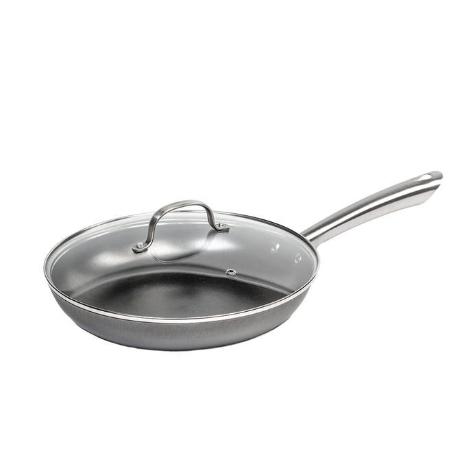 Lightweight nitrogen-hardened cast iron skillet with a smooth stainless steel handle and tempered glass lid, handcrafted for Kitchen & Food and Cookware collections.