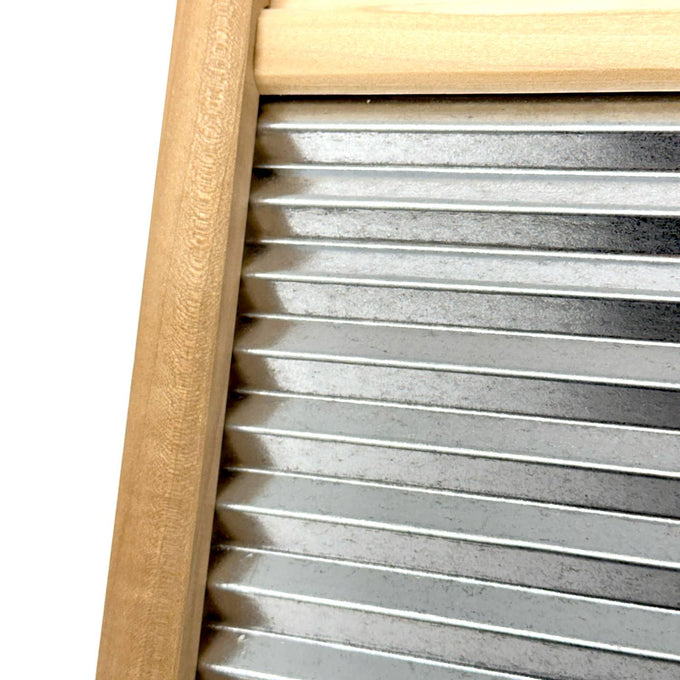 Close-up of a handcrafted wooden-framed washboard featuring a galvanized wavy surface for effective stain removal, perfect for Home & Decor and Laundry Supplies collections.