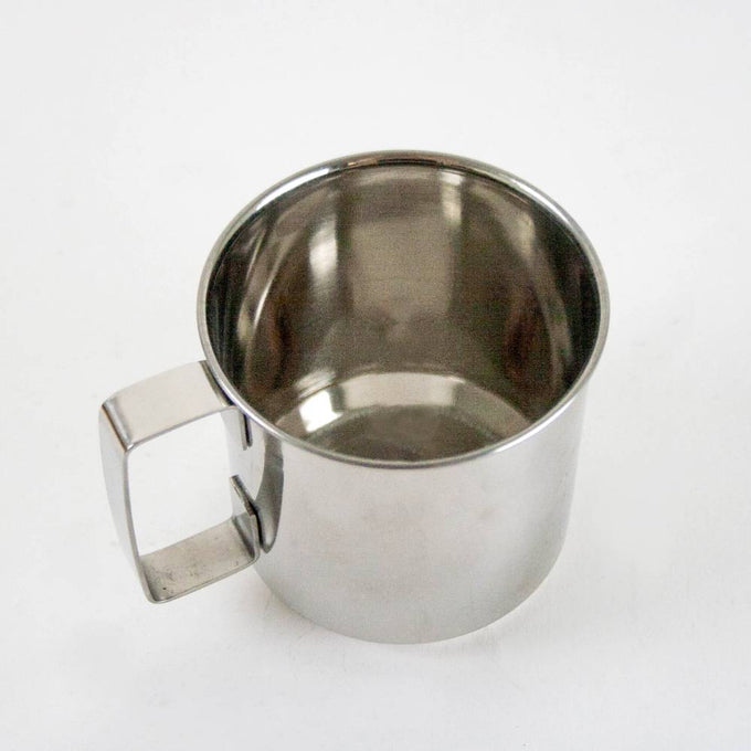 Lightweight yet durable stainless steel cup with a convenient handle, designed for travel and everyday use, featured in Kitchen & Food and Dinnerware collections.