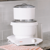 White kitchen appliance featuring a flour sifter attachment with clear lid on a Bosch stand mixer, handcrafted for baking and included in Kitchen & Food and Baking Supplies collections.